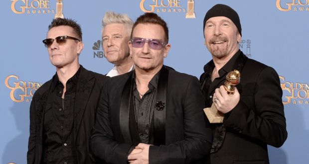 U2’s Larry Mullen, Adam Clayton, Bono and The Edge, winners of Best Original Song for Ordinary Love from Mandela: Long Walk to Freedom, at the 71st Annual Golden Globe Awards held at The Beverly Hilton Hotel in California. Photograph: Kevin Winter/Getty Images