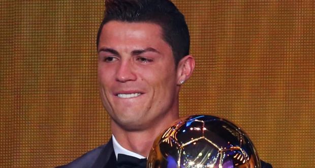 An emotional Cristiano Ronaldo of Portugal receives the FIFA Ballon d’Or 2013 trophy at the Kongresshalle  in Zurich, Switzerland. Photograph: by Martin Rose/Bongarts/Getty Images)