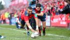 Srumhalf Conor Murray’s feed sends Simon Zebo over for a simple finish in the left corner in yesterday’s Heineken Cup game at Thomond Park. Photograph: Billy Stickland/Inpho
