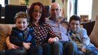 Adrian Gallagher with his wife Emer and sons Cian (6) and Luke (10) at their home in Co Sligo. ‘It is a lot to leave behind: my wife, kids, house and the life I’ve built up.’