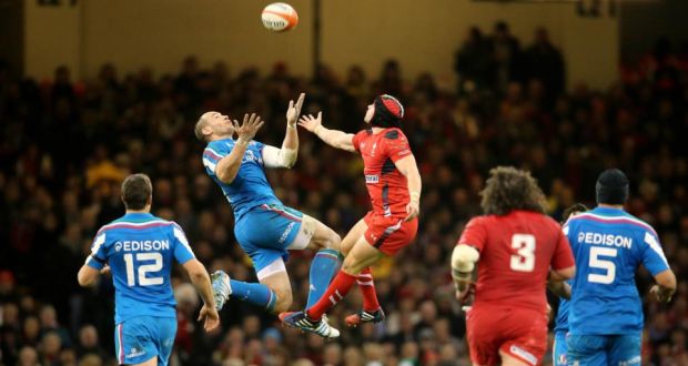 Wales’ Leigh Halfpenny and Sergio Parisse of Italy challenge for the high ball at the Millennium Stadium. Photograph: Cathal Noonan/Inpho