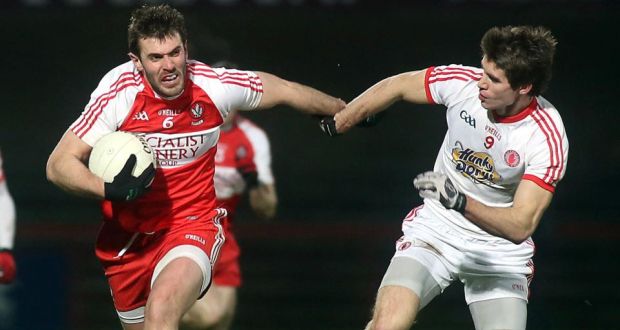 Derry’s Mark Lynch attempts to escape the close attention of Tyrone’s Conan Grugan. Photograph: Lorcan Doherty/Presseye/Inpho  