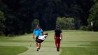 Seve Benson and his caddie walk down the second fairway during practice at the Joburg Open at Royal Johannesburg. Photograph: Dean Mouhtaropoulos/Getty Images