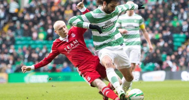 Aberdeen’s Willo Flood tackles Celtic’s Georgios Samaras  during the Scottish Cup fifth-round match at Celtic Park.  Photograph: Jeff Holmes/PA 