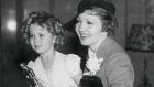 Shirley Temple and Claudette Colbert at the Academy of Motion Pictures Arts dinner, in 1935. 