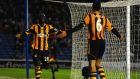 Yannick Sagbo of Hull City celebrates  with Curtis Davies after scoring his side’s equaliser in the FA Cup fifth round tie against Brighton  at Amex Stadium. Photograph: Mike Hewitt/Getty Images