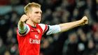  Arsenal’s Per Mertesacker celebrates after the FA Cup fifth round  match against Liverpool.  Photograph: Gerry Penny/EPA