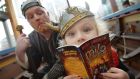 Kelly Saunders (5) from Tallaght with “Viking” Ros Crammond at the launch of World Book Day. Photograph: Alan Betson