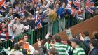 Celtic and Rangers fans taunt each other at an Old Firm derby. But can they really be seen as “two sides of the same debased coind”? Photograph: PA