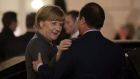 Chancellor Angela Merkel with French president François Hollande as she leaves the Élysée Palace.  Photograph: Reuters