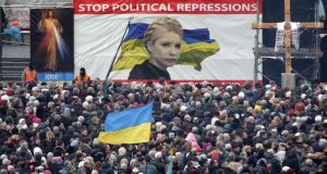 A portrait of Ukrainian opposition leader Yulia Tymoshenko is seen during a rally on Independence Square in downtown of Kiev. Photograph: Maxim Shipenkov/EPA