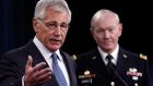 US Secretary of Defense Chuck Hagel (l) and Chairman of the Joint Chiefs of Staff Gen. Martin Dempsey answer questions during a press conference at the Pentagon on February 24th, 2014 in Arlington, Virginia. Photograph: Win McNamee/Getty Images