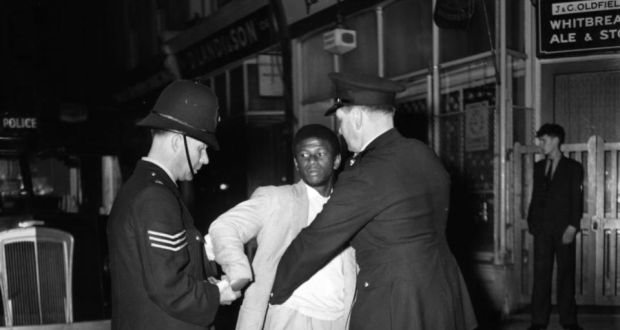 Police search a black youth in Notting Hill during race riots in 1958, subject of Laura Wilson’s The Riot. Photograph: Knoote/Getty Images
