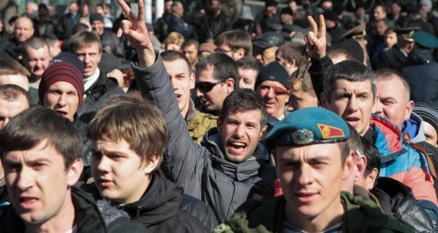 Pro-Russian activists gather to form a local public guard to oppose pro-EU groups in Simferopol in the Crimea yesterday. Photograph: Reuters 