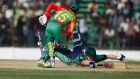 Ireland’s William Porterfield dives to make his ground during the  match in Fatullah. 