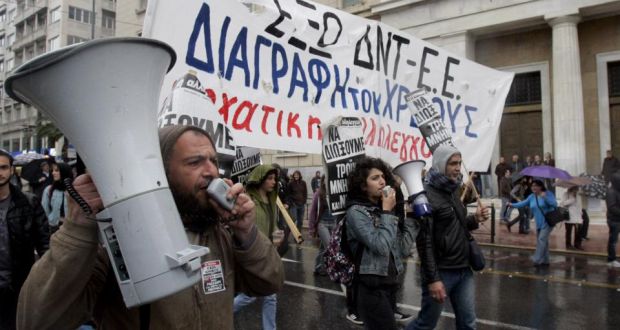 Protesters  demonstrate against the visit of Germany’s Chancellor Angela Merkel last week in Athens,  a day after Greece  returned to international bond markets. Photograph:  Milos Bicanski/Getty Images