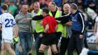 The angry scenes as Cavan under-21 manager Peter Reilly confronts referee Derek O’Mahoney at the end of the game against the Dublin under-21s as stewards hold a spectator back. Photograph:  Donall Farmer/Inpho