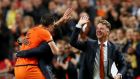 Robin van Persie of the Netherlands celebrates with coach  Patrick Kluivert and manager Luis van Gaal after scoring their fourth goal during the  World Cup Qualifing match against  Hungary at Amsterdam Arena last year.