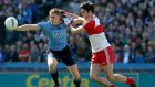 Dublin’s Eoghan O’Gara keeps possession from  Chrissy McKaigue of Derry in the National Football League Division One final at Croke Park. Photograph: Donall Farmer/Inpho.
