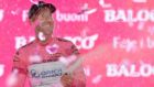  Canadian rider Svein Tuft of the Orica Greenedge team   celebrates on the podium after his team had won the first stage of the 2014 Giro d’Italia in Belfast.