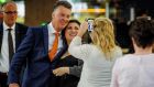  Louis van Gaal poses with  fans  prior to the departure of the Dutch national soccer team to Portugal for a pre-World Cup training camp.
