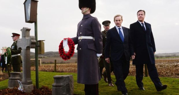 Taoiseach Enda Kenny and British prime minister David Cameron visit the grave of Willie Redmond in December 2013. Photograph: PA
