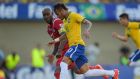 Neymar of Brazil and Felipe Baloy of Panama compete for the ball  at the Serra Dourada Stadium. Photograph:    Buda Mendes/Getty Images
