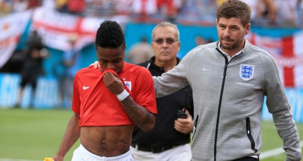 England’s Steven Gerrard (right) consoles teammate Raheem Sterling (left) after he was shown a red card against Ecuador  at the Sun Life Stadium in Miami, USA. Photograph:  Mike Egerton/PA Wire
