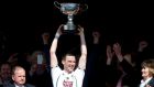 Kildare’s Niall O’Muineachain lifts The Christy Ring Cup after victory over Kerry. Photograph: Inpho