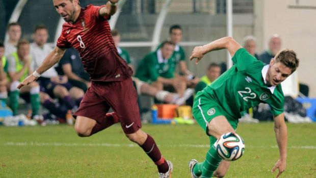 Portugal’s Joao Moutinho (left)  after he colliding with Ireland’s Kevin Doyle  in the second half of their international friendly  ahead of the 2014 World Cup in East Rutherford, New Jersey, last night. Photogrraph: Ray Stubblebine/Reuters