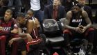 Miami Heat players Shane Battier, Chris Bosh, Dwyane Wade and LeBron James sit on the bench in the final minutes of their loss to the San Antonio Spurs. Photograph: Mike Stone/Reuters