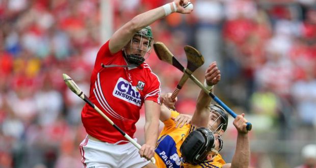 Cork’s Aidan Walsh climbs above the Clare duo of Pat Donnellan and John Conlon to catch the sliotar during the Munster SHC semi-final at Semple Stadium. Photograph: Cathal Noonan/Inpho
