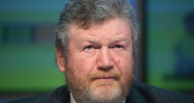  Minister for Health Dr James Reilly:  his  decision went much further than anyone expected, by backdating the reinstatement of discretionary medical cards to mid-2011. Photograph: Gareth Chaney Collins