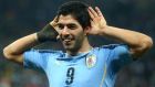 Luis Suarez celebrates after scoring his second goal in Uruguay’s 2-1 win over England. Photograph: EPA