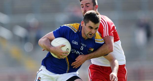 Longford’s Kevin Diffley gets past Derry’s Mark Craig in the GAA Football All Ireland Senior Championship Qualifier Series Round 1A, at Celtic Park, Derry, at the weekend.  Photograph: John McIlwaine/Inpho