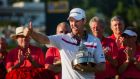  Justin Rose holds  the trophy after winning the Quicken Loans National at Congressional Country Club in Bethesda, Maryland USA.  Rose beat US golfer Shawn Stefani after a one hole playoff. Photo: Jim Lo Scalzo/EPA