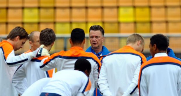 Netherlands’ coach Louis van Gaal talks with his players during a training session one day before their World Cup semi-final soccer match against Argentina at the Paulo Machado de Carvalho Stadium in Sao Paulo, Brazil. Photograph:  Manu Fernandez/AP