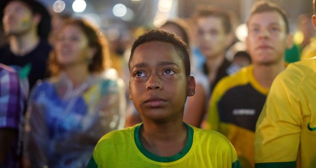A Brazil soccer fan cries as he watches his team during a live telecast of the semi-finals World Cup soccer match between Brazil and Germany on Tuesday. Market experts say the defeat may put Brazilian markets under pressure. Photograph: Leo Correa/AP Photo