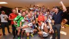Germany’s players and head coach Joachim Löw celebrate in their dressing room with Chancellor Angela Merkel following their victory in the World Cup final on Sunday night. Photograph: Lars Baron/Fifa/Getty Images.