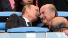 Russian president Vladimir Putin speaks to FIfa president Sepp Blatter during the World Cup final between Germany and Argentina. Photograph: Dylan Martinez/Reuters