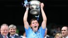 Dublin captain Con O’Callaghan lifts the cup after his side’s victory over Kildare in the Leinster minor football final. Photo: Cathal Noonan/Inpho