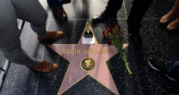 Flowers and a Oscar souvenir is placed on the Hollywood Walk of Fame star for US actor Robin Williams in Hollywood, California, today. Photograph: Michael Nelson/EPA 
