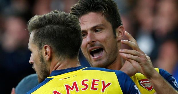 Arsenal’s Olivier Giroud (right) celebrates with team mate and fellow goalscorer Aaron Ramsey   at Goodison Park. Photograph: Andrew Yates / Reuters 