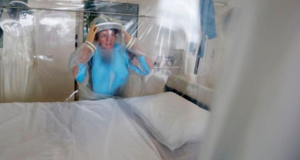 Matron Breda Athan demonstrates putting on the protective suit which would be used to treat patients suffering from Ebola at The Royal Free Hospital in London. Photograph: Suzanne Plunkett/Reuters/Files 