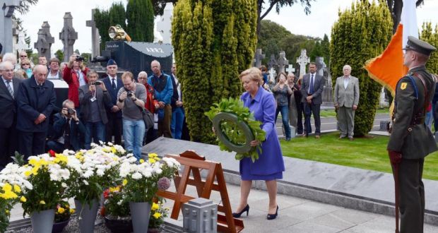 Minister for Justice and Equality Frances Fitzgerald , lays a wreath at the grave of Michael Collins, at the Collins Griffith Commemoration , at Glasnevin Cemetary. Photograph: Eric Luke / The Irish Times