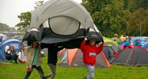 Well-prepared festival-goers arrive with a pre-erected tent at the Electric Picnic music festival at Stradbally Hall in Co Laois today. Photograph: Reuters 