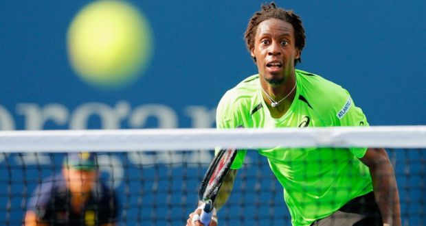 Gael Monfils of France returns a shot against Grigor Dimitrov of Bulgaria in their men’s singles fourth round match   at the US Open. 