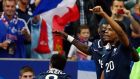 France’s Loic Remy (right) celebrates with team mates after scoring against Spain  at the Stade de France. Photograph: Benoit Tessier / Reuters 