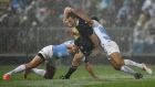 New Zealand  wing Ben Smith is tackled by Argentina’s Agustin Creevy and  Nicolas Sanchez at McLean Park in Napier. Photograph: Marty Melville/AFP/Getty Images