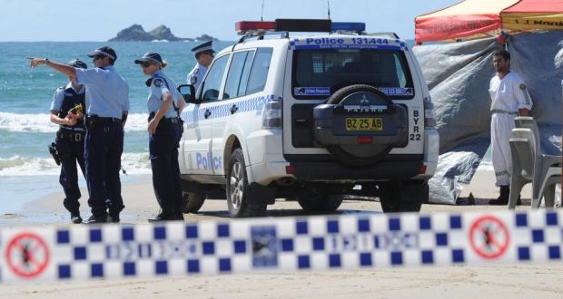 Members of the Australian Police  at Byron Bay, New South Wales.  A middle-aged man died following a shark attack while swimming in the bay. Photograph: Dave Hunt/EPA